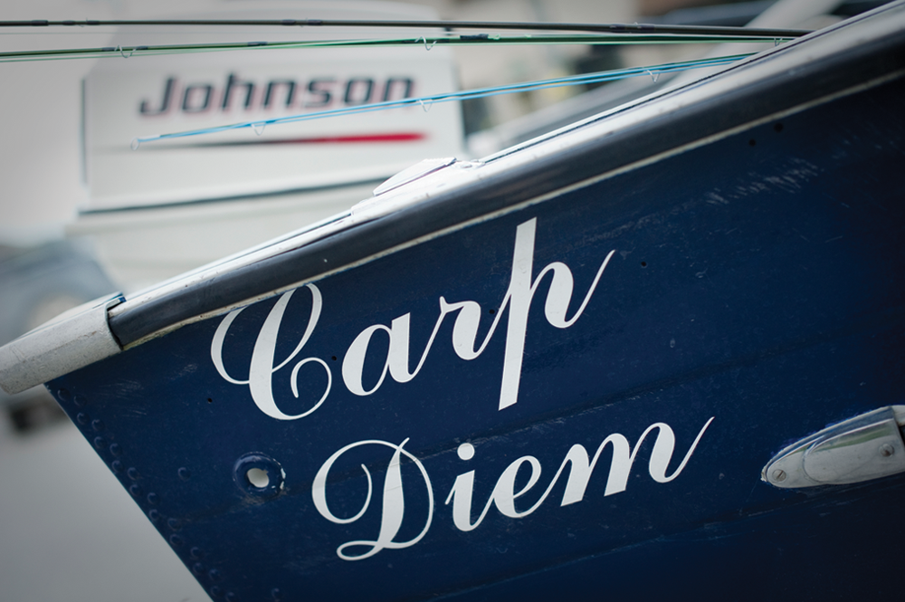 Close up photo of a boat named Carp Diem