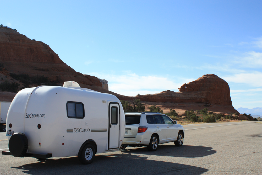 Egg Camper driving through desert
