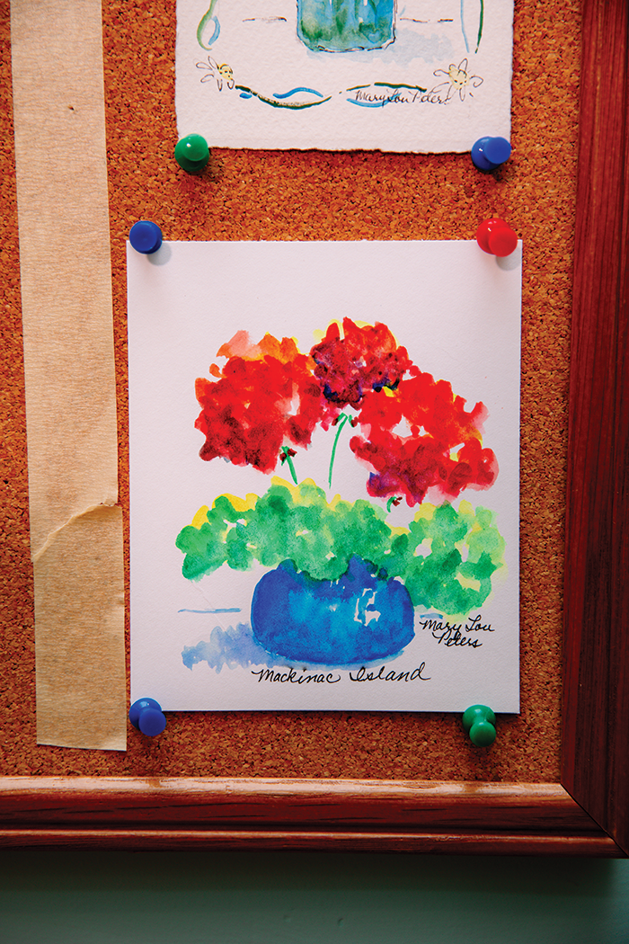 A solo geranium piece sings Mackinac Island with its jaunty blues and vibrant, fresh reds.