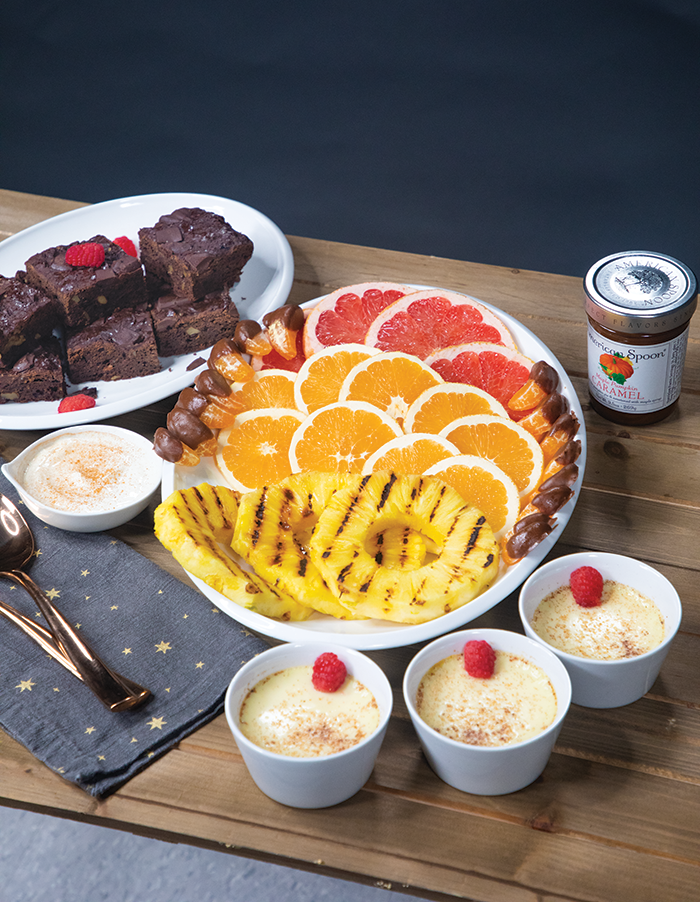 A delicious fruit tray, rich and flavorful brownies, and sweet little custard cups get rave reviews from partygoers.